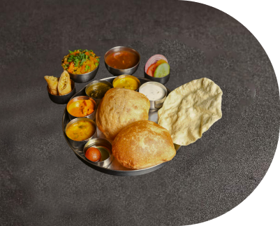 North Indian Meal Platter with Puris, Curries, Chutneys and Papad