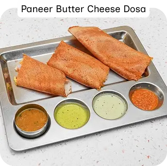 Paneer Butter Cheese Dosa Served with South Indian Chutneys and Sambar