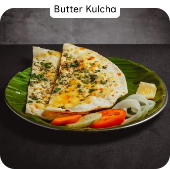 Butter Kulcha Served with Fresh Salad at an Indian Restaurant in Croydon