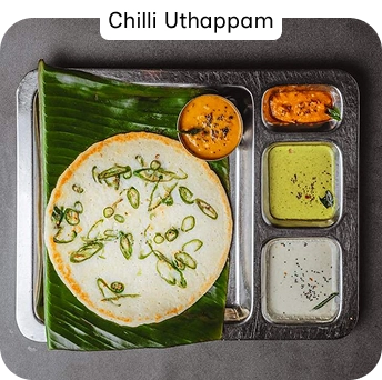 Chilli Uthappam with Coconut Chutney and Sambar at a South Indian Restaurant in Croydon